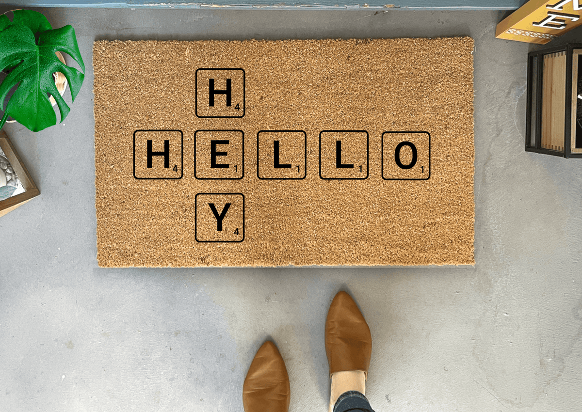 http://nickel-designs.com/cdn/shop/files/doormat-hello-scrabble-tile-doormat-1_1200x1200.png?v=1684406040