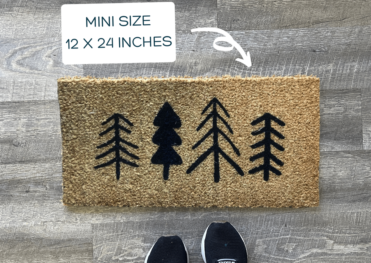 http://nickel-designs.com/cdn/shop/products/doormat-christmas-trees-mini-playhouse-doormat-12-x-24-4_1200x1200.png?v=1663264285