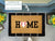 Baseball Home Coir Doormat on front porch with black rug underneath