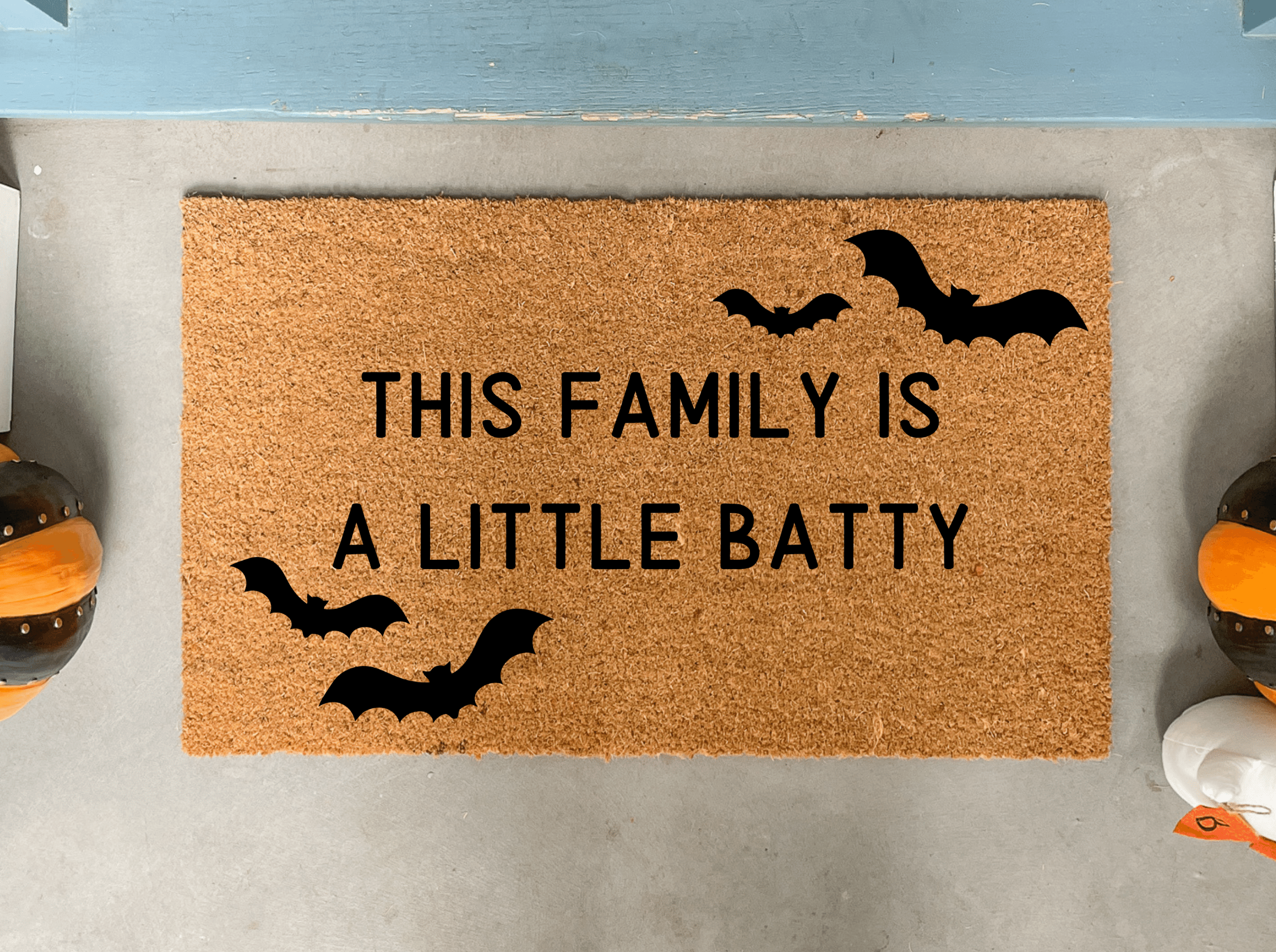 https://nickel-designs.com/cdn/shop/products/doormat-funny-halloween-front-door-mat-this-family-is-batty-1@2x.png?v=1680752244