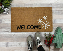 https://nickel-designs.com/cdn/shop/products/doormat-welcome-snowflake-winter-doormat-1_219x.progressive.jpg?v=1654896392