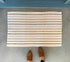 Blue and White Woven Doormat Layering Rug